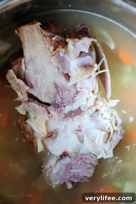 If you’re looking for leftover ham recipes, you’ll love this leftover ham bone and potato soup! It’s hearty, flavorful, and easy to make too. Ham bone in pot of soup