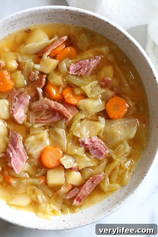 If you’re looking for leftover ham recipes, you’ll love this leftover ham bone and potato soup! It’s hearty, flavorful, and easy to make too. Bowl of leftover ham bone soup with potatoes and cabbage
