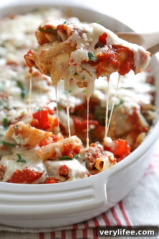Penne baked with cheese, sauce and loaded with healthy vegetables in every bite. Roasted zucchini, red bell peppers, asparagus, red onion and fennel are tossed with balsamic and herbs then roasted for the best tasting meatless baked pasta dish EVER!
