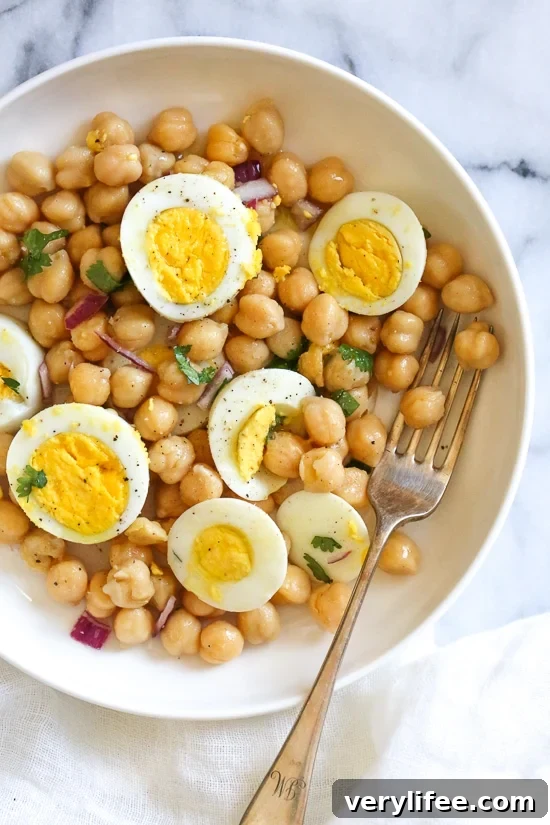 This easy chickpea and egg salad is so simple and delicious for lunch (or breakfast!). It's inexpensive to make, high in protein and fiber and great to make ahead for the week.