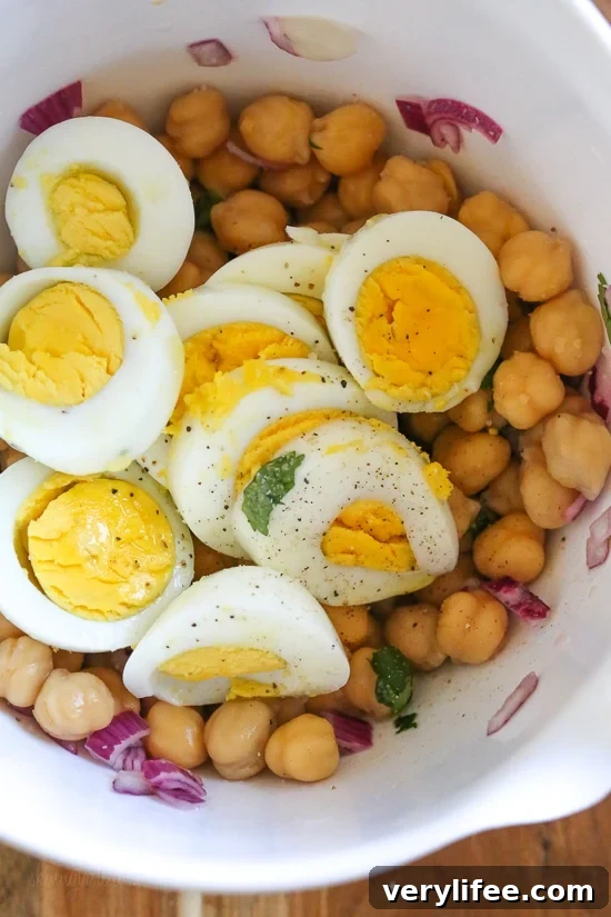 Chickpea and egg salad in a bowl, ready to serve.