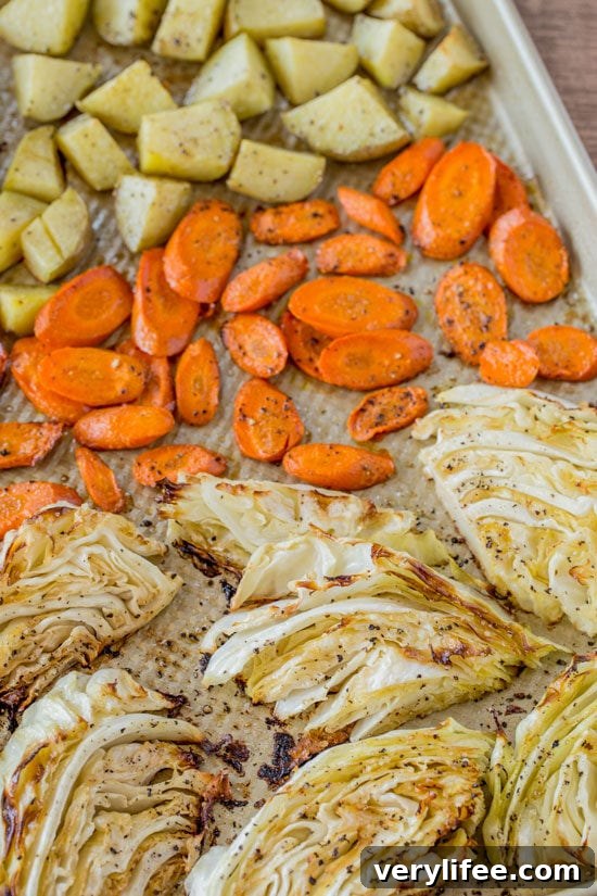 Roasted vegetables and turkey on a baking sheet Roasted Corned Beef Vegetables on baking sheet