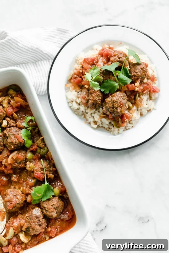 Moroccan Kefta Meatballs made with tomatoes and olives are simmered together in the slow cooker or Instant Pot in this easy and exotic Moroccan dinner.