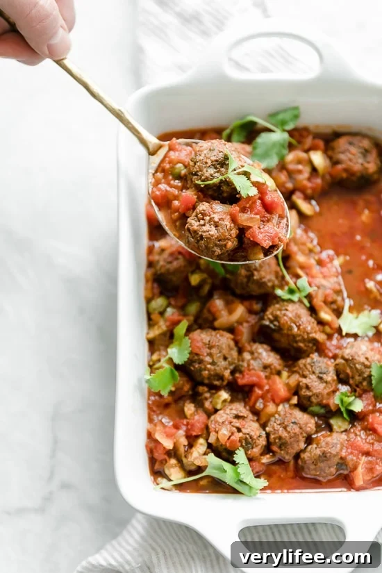 Moroccan Kefta Meatballs made with tomatoes and olives are simmered together in the slow cooker or Instant Pot in this easy and exotic Moroccan dinner.