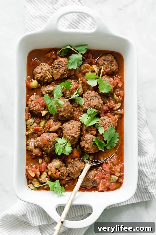 Moroccan Kefta Meatballs made with tomatoes and olives are simmered together in the slow cooker or Instant Pot in this easy and exotic Moroccan dinner.