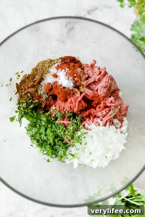 Moroccan Kefta Meatballs made with tomatoes and olives are simmered together in the slow cooker or Instant Pot in this easy and exotic Moroccan dinner.