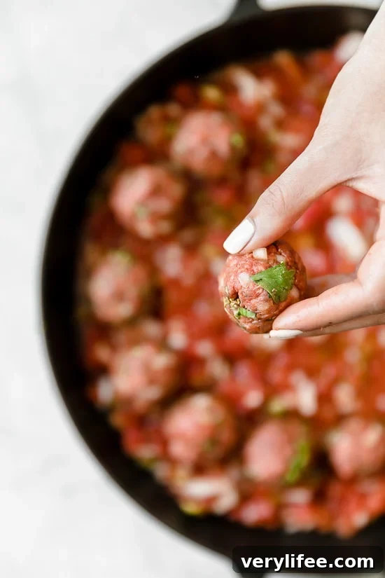 Moroccan Kefta Meatballs made with tomatoes and olives are simmered together in the slow cooker or Instant Pot in this easy and exotic Moroccan dinner.