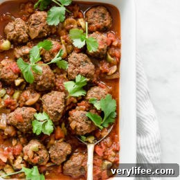 Moroccan Kefta Meatballs made with tomatoes and olives are simmered together in the slow cooker or Instant Pot in this easy and exotic Moroccan dinner. Whole30, gluten-free and Paleo.