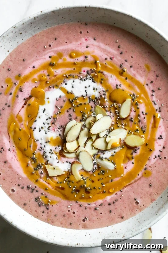 Smoothie bowl with strawberries and peanut butter swirl