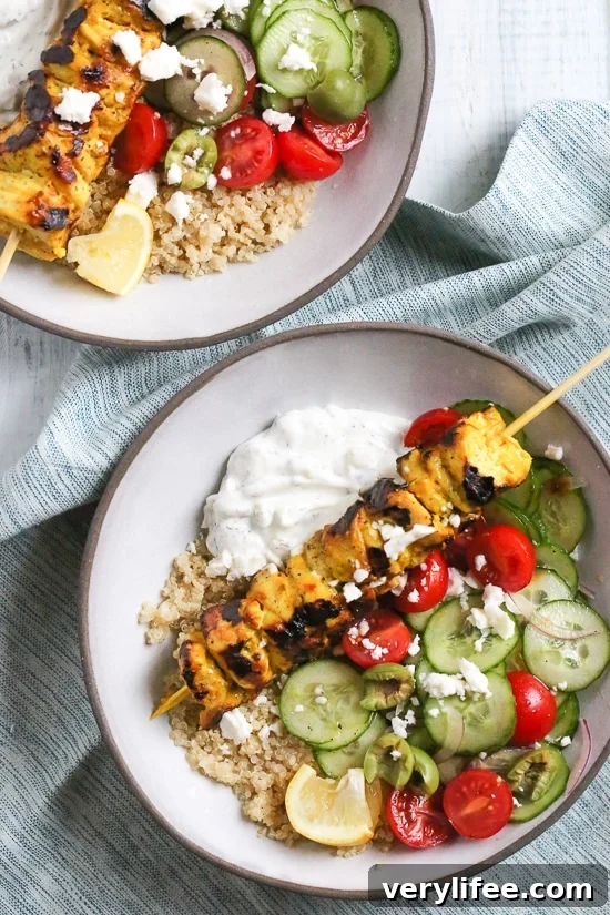 Smoky yogurt-marinated grilled chicken served over quinoa and Mediterranean-inspired tomatoes, cucumbers, and olives with tzatziki and Feta.