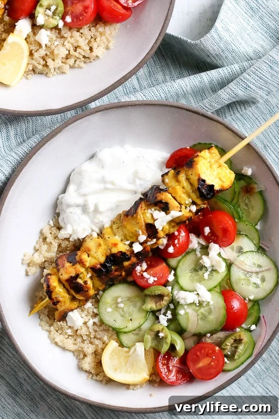 Smoky yogurt-marinated grilled chicken served over quinoa and Mediterranean-inspired tomatoes, cucumbers, and olives with tzatziki and Feta.