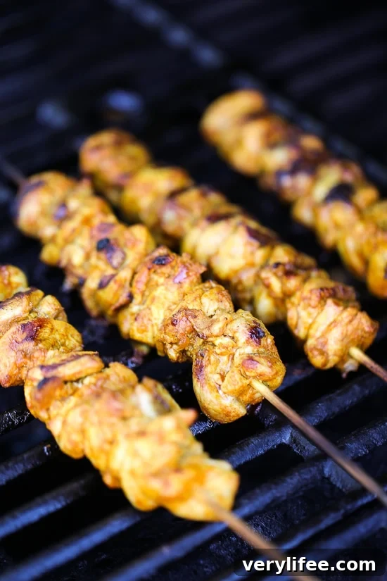 Spiced Chicken Shawarma Kebab Salad Recipe 5 Salad with cucumber, tomatoes, red onion and feta topped with chicken kebab.