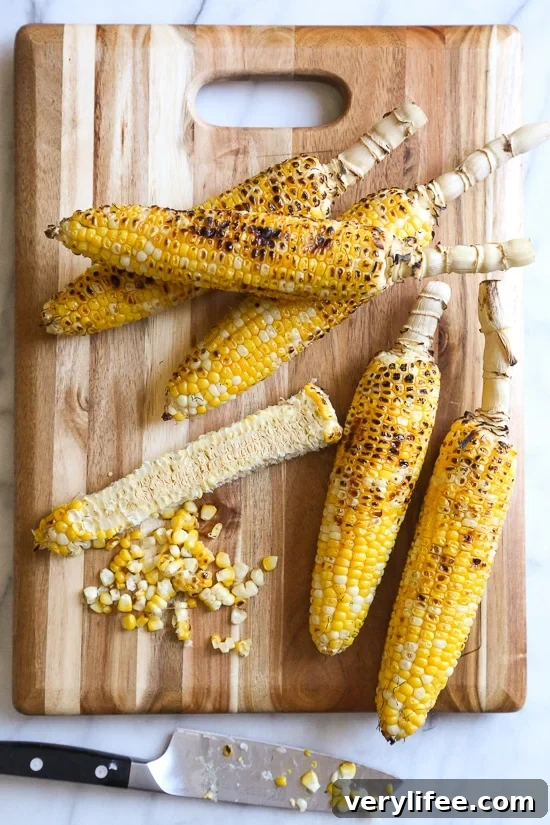 Charred grilled corn in a salad with feta and herbs