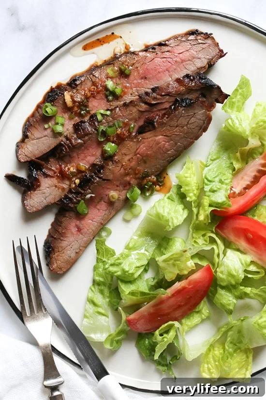 Soy-Marinated Flank Steak Recipe 2 The marinade in this Grilled Asian-style Soy Marinated Flank Steak takes an uninteresting piece of steak and turns it into a mouthwatering dish!