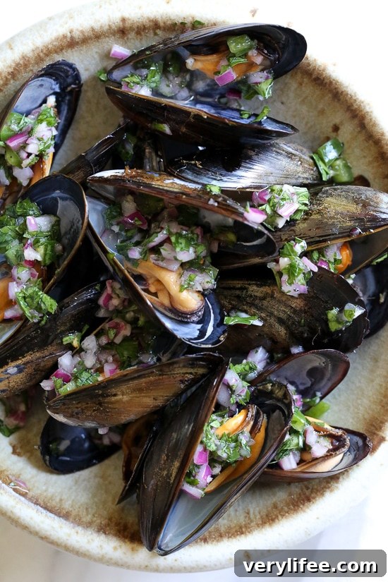 Steamed mussels get a kick with spicy Piri Piri Sauce which is basically a kicked up chimichurri sauce. 