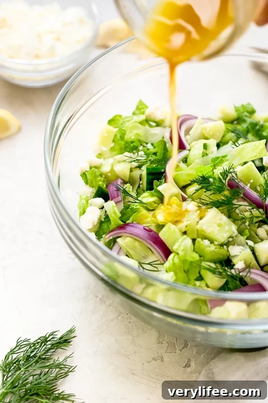 Mediterranean Chopped Salad with Feta 2 Chopped salad with romaine lettuce, Feta cheese, cucumbers, red onion and dill tossed with a simple red wine vinaigrette. An easy side salad to go with all your Mediterranean dishes.