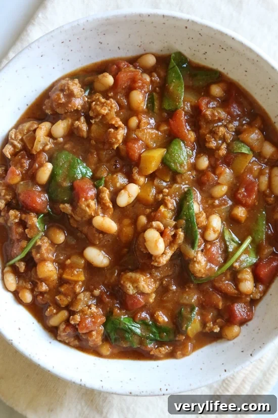 Savory Turkey and Pumpkin Chili Recipe 4 Turkey Pumpkin Chili is the perfect Fall dish made with ground turkey, tomatoes, canned pumpkin, white beans and spinach.