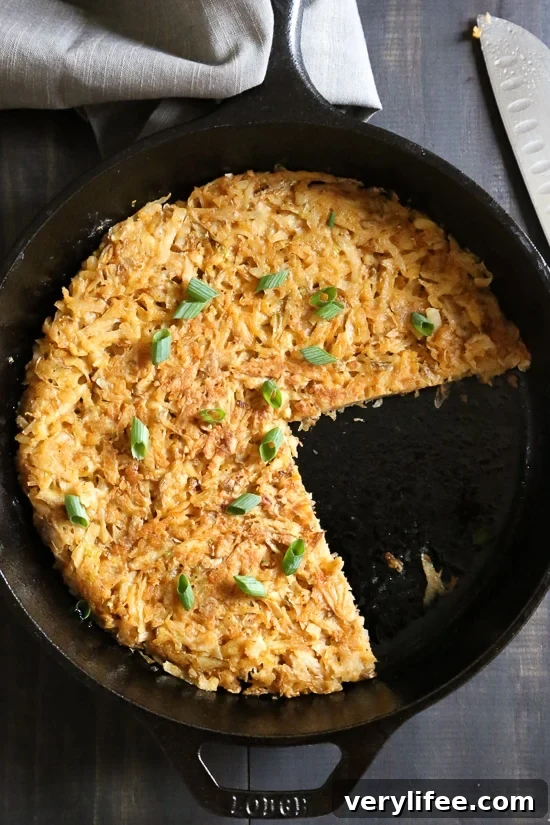Hash browns in skillet with portions removed