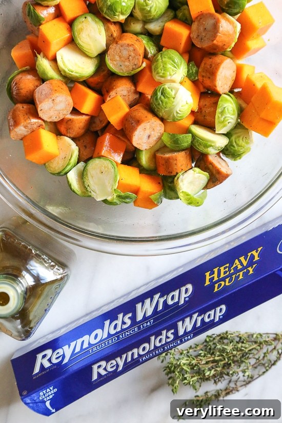 Spicy Sausage Foil Packets with Brussels Sprouts and Butternut 4 Close up of roasted Brussels sprouts and butternut squash with sausage.