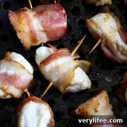 Bacon wrapped chicken bites are the easiest appetizer, made with just TWO ingredients. Using the air fryer, the bacon comes out crisp on the outside, and the chicken juicy and tender inside.