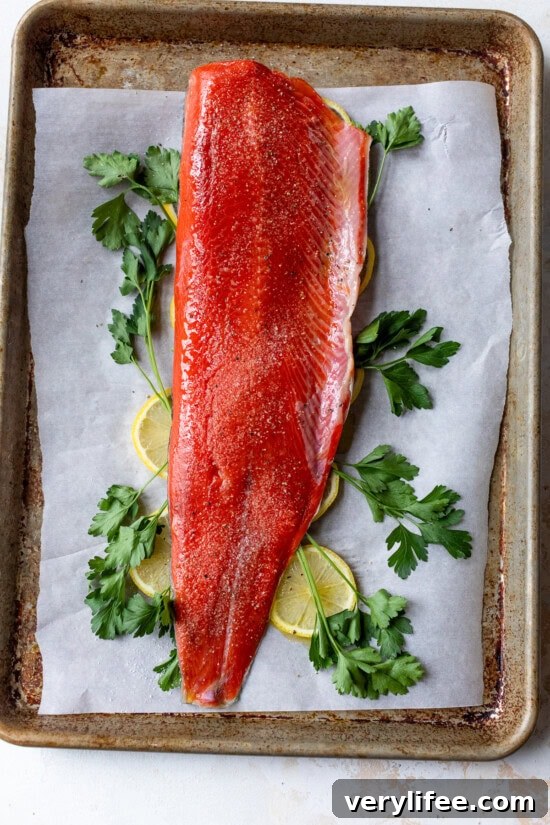 Lemon Garlic Oven-Baked Salmon Recipe 7 Top with a whole piece of salmon.