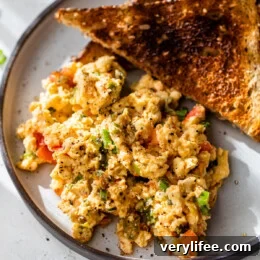 Huevos pericos on plate with 2 slices of toast