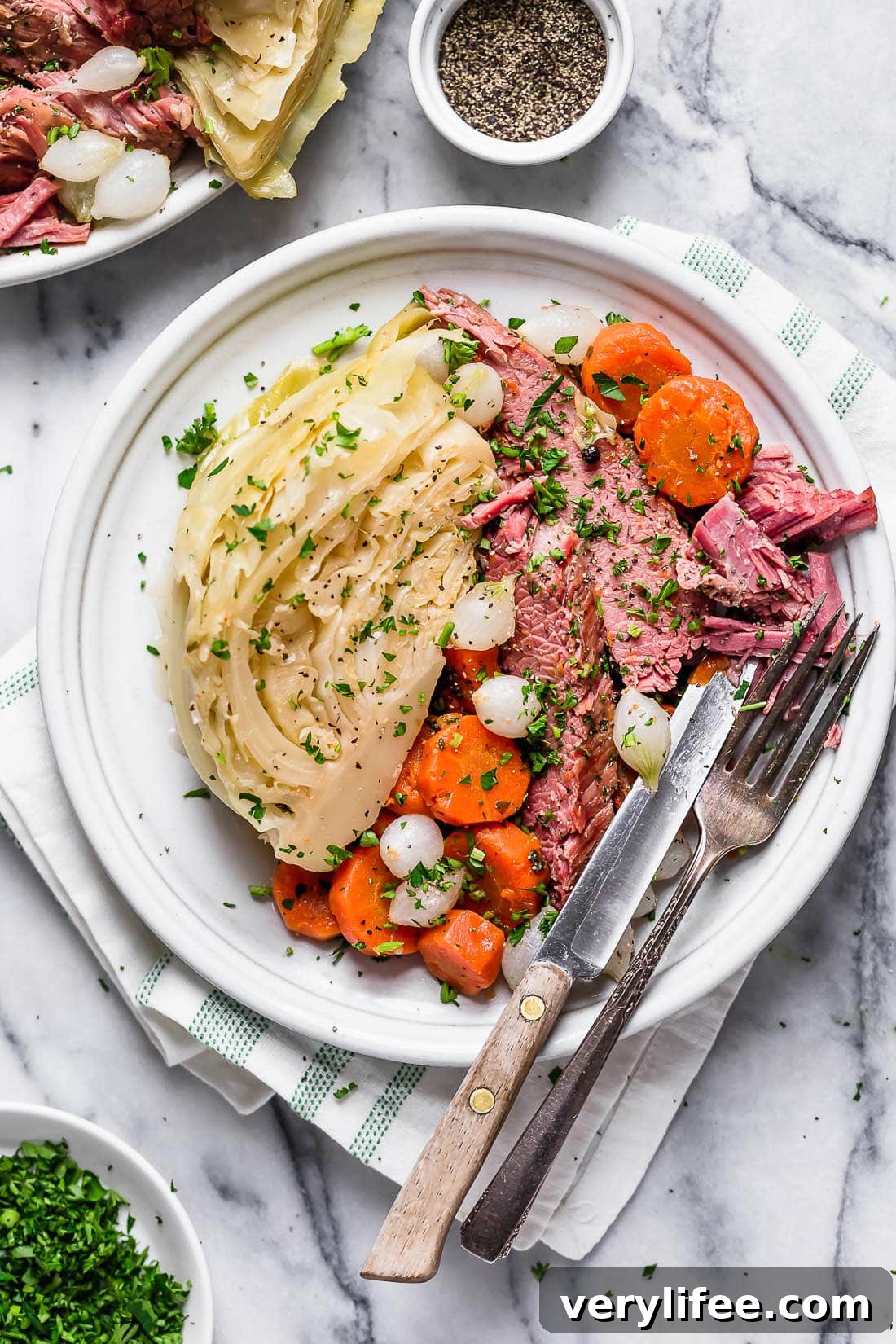 Overhead view of a plate of corned beef and cabbage with carrots