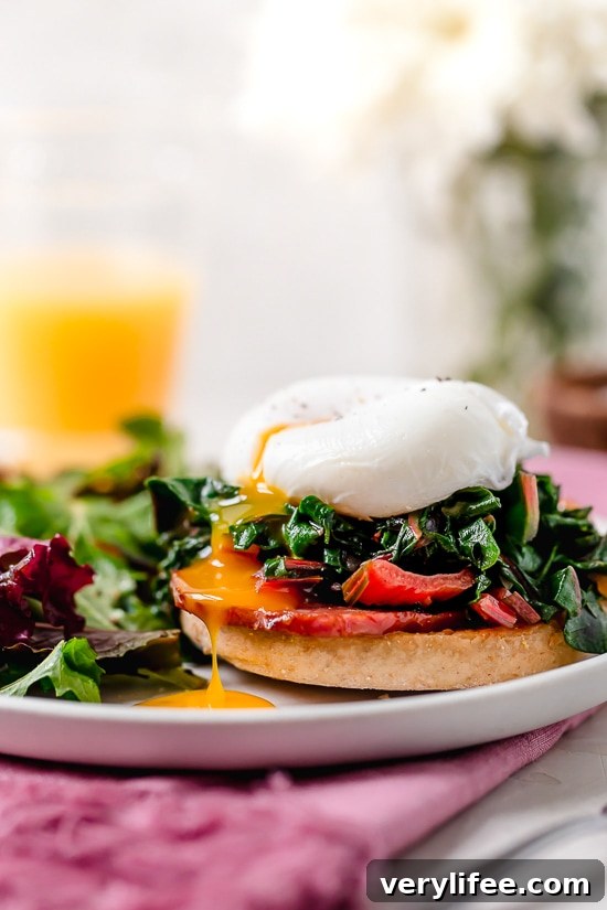 Swiss Chard Eggs Benedict close-up on a whole wheat English muffin