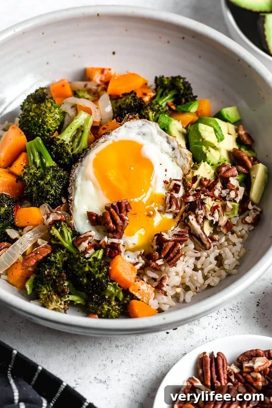 Buddha bowl with brown rice, vegetables and fried egg Buddha bowl with brown rice, vegetables and fried egg