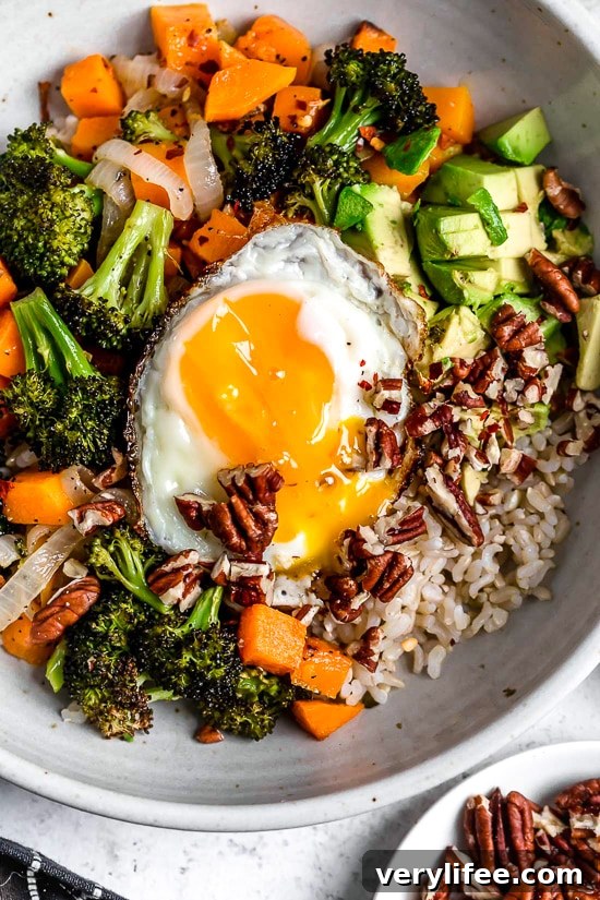 Buddha bowl with fried egg Overhead view of Buddha bowl with fried egg
