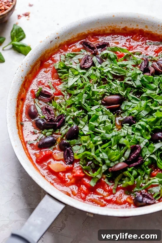 Sea bass fillets served with Mediterranean tomato-fennel sauce.