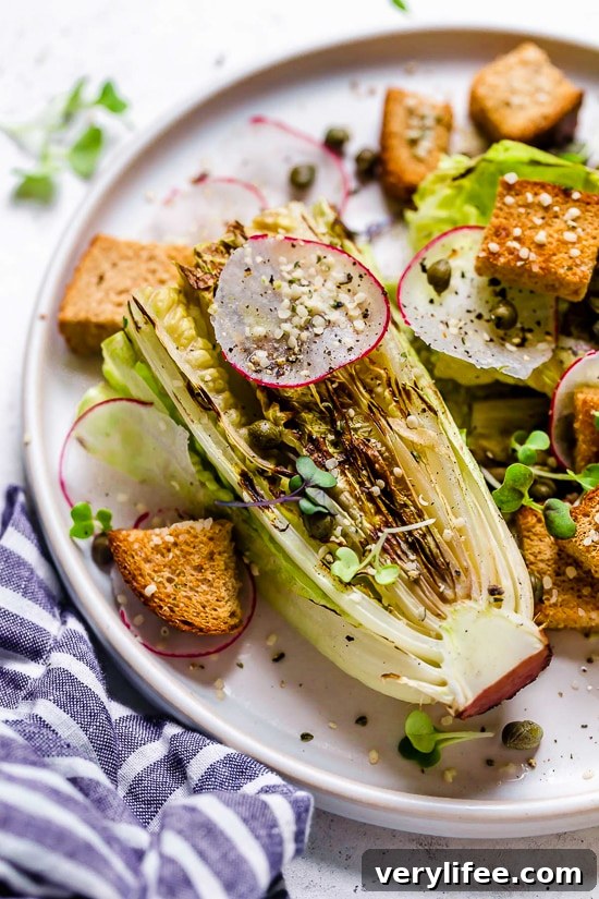 Plate of vegan Caesar salad with grilled romaine.