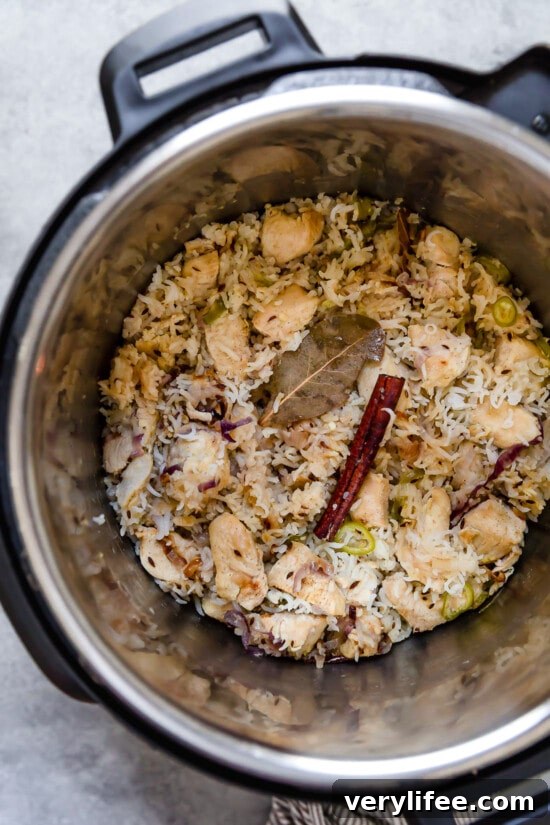 Chicken pulao ingredients in an Instant Pot Chicken pulao ingredients in an Instant Pot