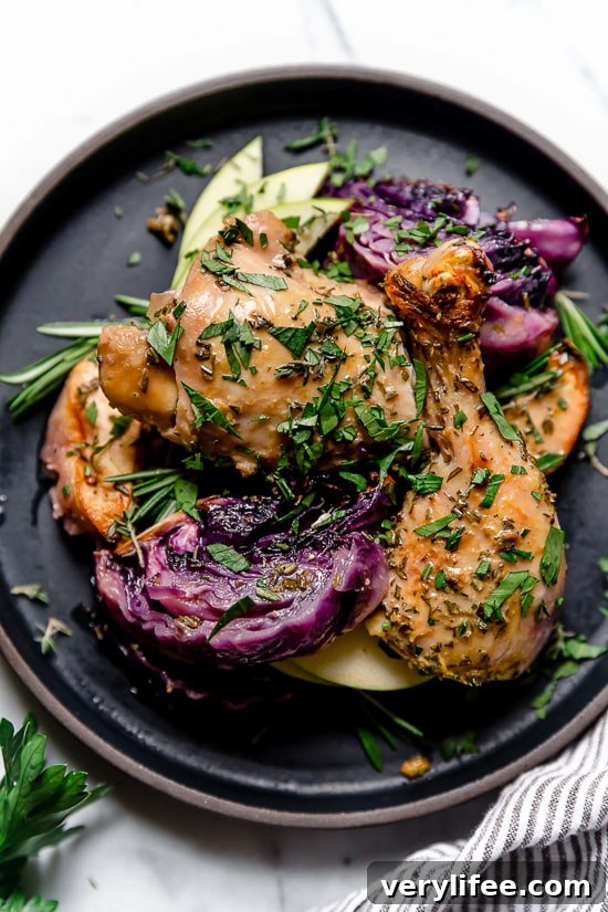 Baked Apple Cider Chicken and Cabbage is the perfect one-pot fall dish made with cider-marinated chicken, red cabbage and apples.