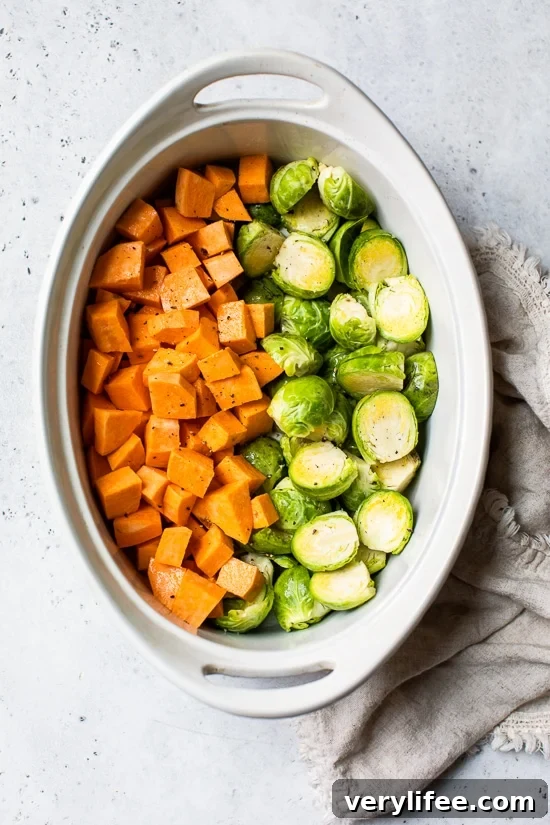 Baked Chicken Thighs with Brussels Sprouts and Sweet Potatoes 5 baking dish with sweet potatoes and brussels sprouts