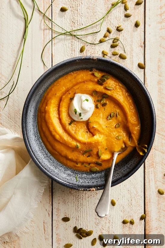 This healthy, creamy Pumpkin Ginger Soup is the perfect cozy, fall soup made creamy without adding any cream. Instead, the vegetables and Greek yogurt thicken it!
