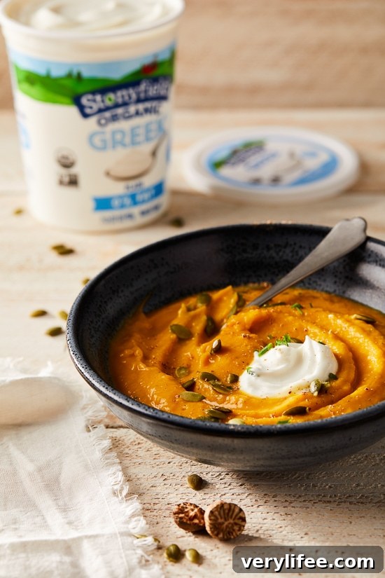 This healthy, creamy Pumpkin Ginger Soup is the perfect cozy, fall soup made creamy without adding any cream. Instead, the vegetables and Greek yogurt thicken it!