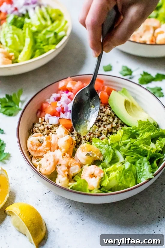 Lemon-Chili Shrimp Quinoa Bowls with lemon dressing.