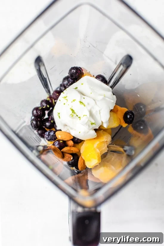 Tropical Lassi is a healthy, Indian yogurt drink blended with frozen mango, tart blueberries and spices.