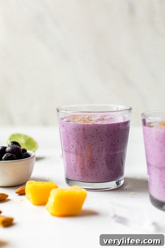 Tropical Lassi is a healthy, Indian yogurt drink blended with frozen mango, tart blueberries and spices.