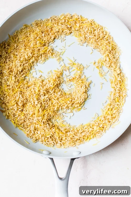 Toasting rice and pasta in a skillet.
