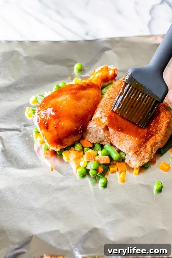 brushing bbq sauce on chicken