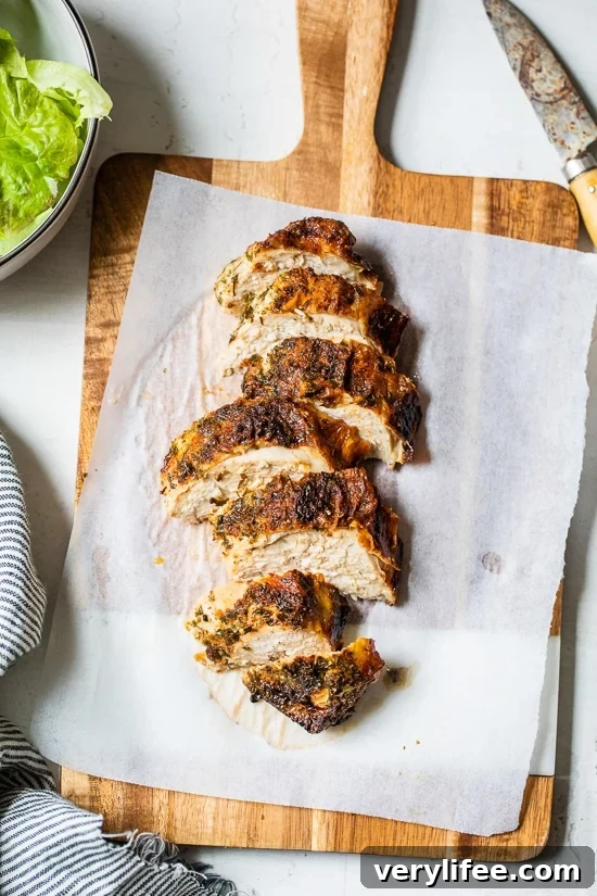 sliced chicken breast on cutting board