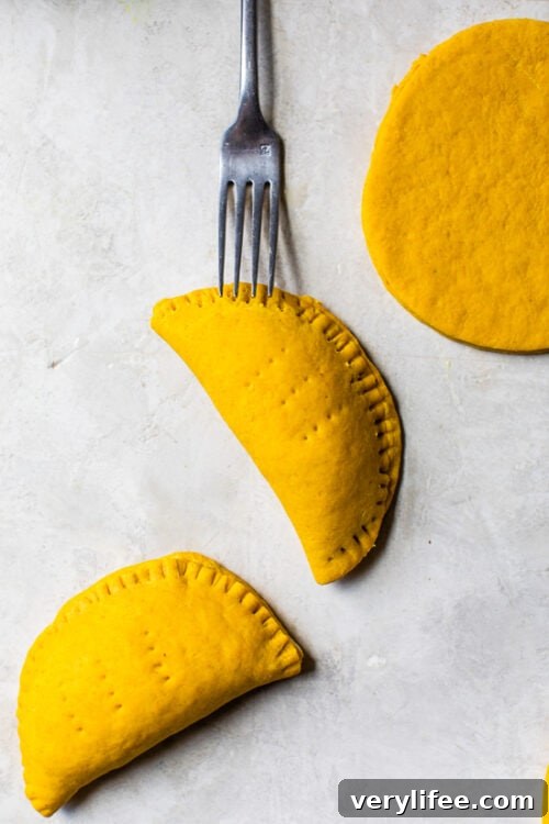 Jamaican Beef Patties with poked fork holes before baking