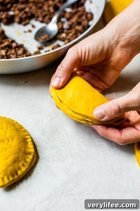 folding Jamaican Beef Patties before baking