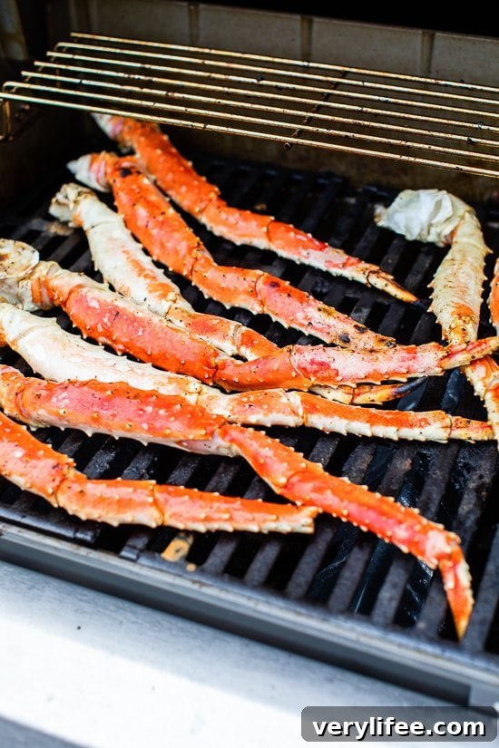 Smoky Grilled Crab Legs with Lemon Garlic Butter 3 King Crab Legs on the grill
