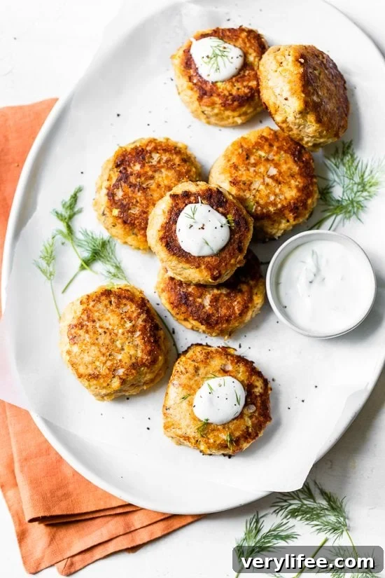 These low-carb Salmon Croquettes with Dill Sauce are healthier than traditional deep-fried ones and use only egg as a binder rather than breadcrumbs or crackers.