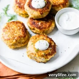 These low-carb Salmon Croquettes with Dill Sauce are healthier than traditional deep-fried ones and use only egg as a binder rather than breadcrumbs or crackers.