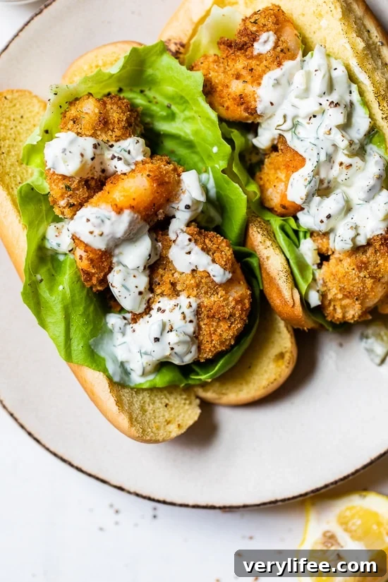 Crispy Air Fryer Shrimp Sandwich with Zesty Tartar Sauce 2 Air Fryer Shrimp Sandwich is made with crispy shrimp served on a soft potato bun with lettuce and homemade tartar sauce, the perfect summer sandwich.