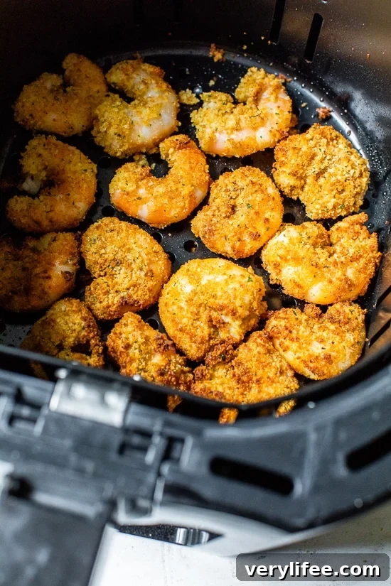 Crispy Air Fryer Shrimp Sandwich with Zesty Tartar Sauce 4 air fryer shrimp in basket
